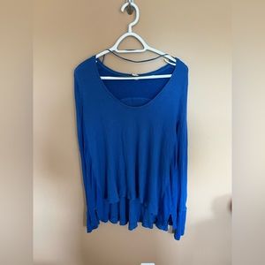 Size xs blue Free People long sleeve. More of a loose fit than xs.